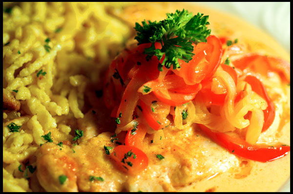 Tender Chicken Breast topped with Fresh Sautéed Red Bell Peppers and Onions in a Mild Paprika Sauce served with Spätzle.