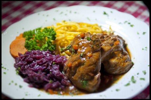 A Traditional German Fall Dish. Tender Pieces of Locally Farm-Raised and Slowly Pot-Roasted Rabbit, served with Spätzle and Red Cabbage.