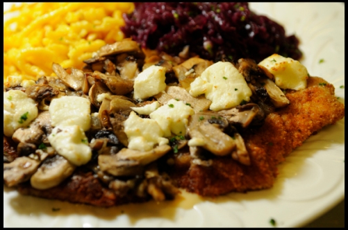 Breaded Pork Loin topped with fresh sautéed Mushrooms and warm Goat Cheese served with Spätzle & Red Cabbage
